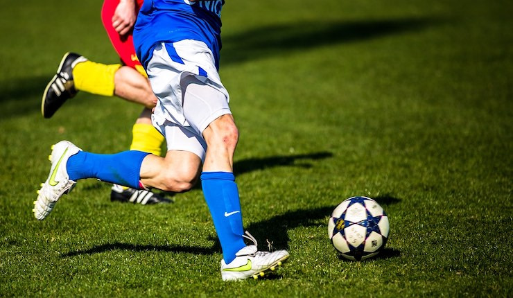 Footballer running with the ball