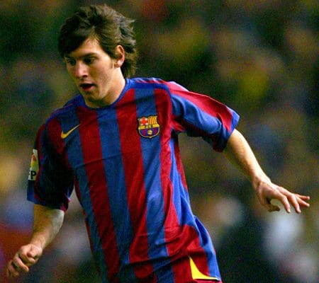 A young Lionel Messi dribbles the ball while playing for Barcelona B.
