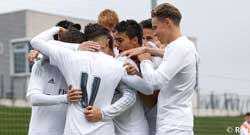football-club-b-teams-image Real Madrid Castilla players huddle together after scoring a goal.