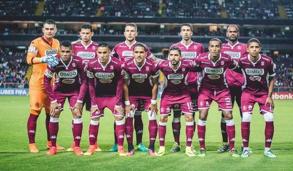 Deportivo Saprissa's squad line up for a team photograph.