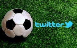 Twitter logo next to an unbranded football.