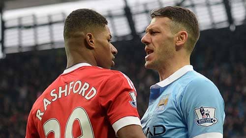 Martin Demichelis squares up to Marcus Rashford in the Manchester Derby.