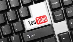 lay-the-draw-trading-video-image Computer keyboard with YouTube key