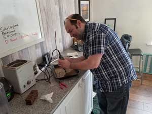 Gavin Hardy, making sea glass jewelry at Seaham Waves