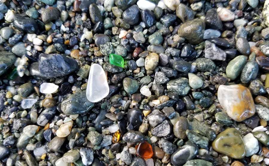 Sea glass laying on the beach at Glass Beach, Port Townsend