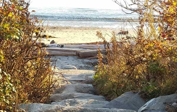 Small stone path that leads to Lands End beach on Bailey Island.