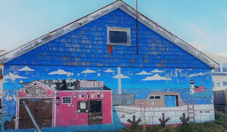 Image of painted boat house in Maine.