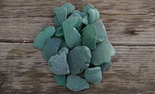 Pieces of forest green sea glass
