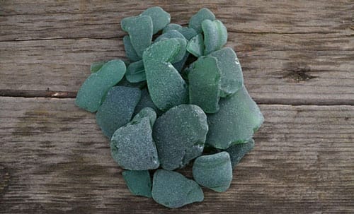 Pieces of forest green sea glass