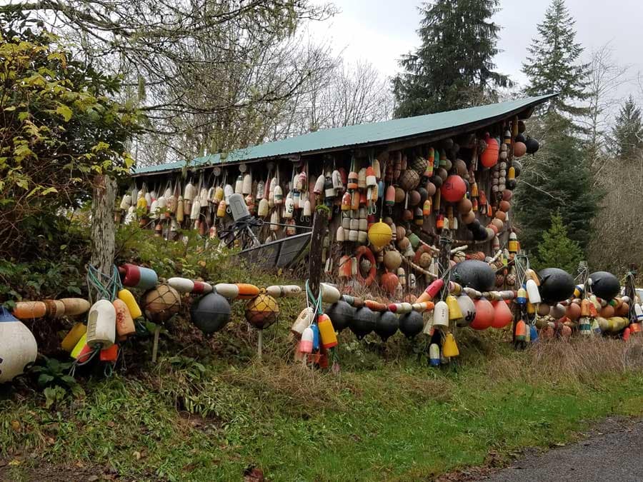 A barn covered with lobster pot floats and buoys in Forks, Washington