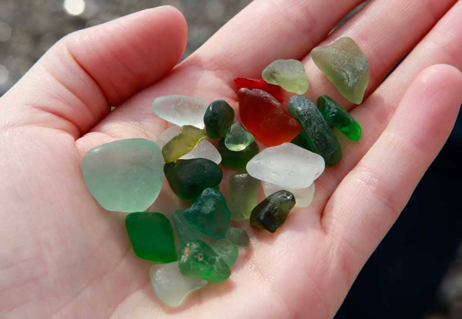 Sea glass held in the palm of a hand