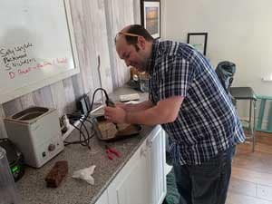Gavin Hardy, making sea glass jewelry at Seaham Waves