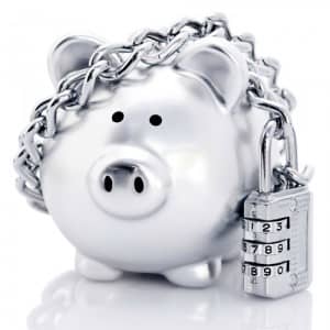 Piggy bank with a padlock and chain wrapped around it.