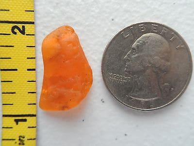 A piece of orange sea glass