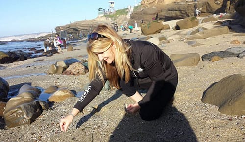 Jonna Marie collecting sea glass at La Jolla, San Diego