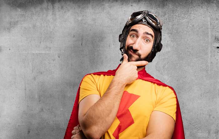 Man in a superhero costume with a questioning look.