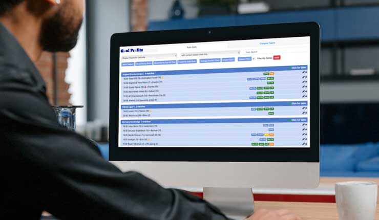 A man looking at Team Stats on his laptop