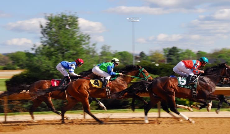 Horses racing at high speed