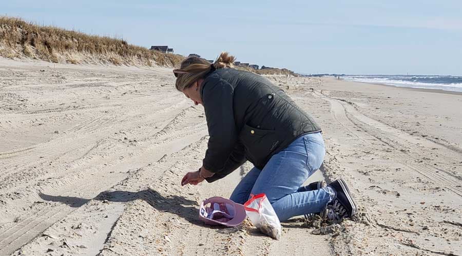 Searching for sea glass on Hatteras beach, North Carolina